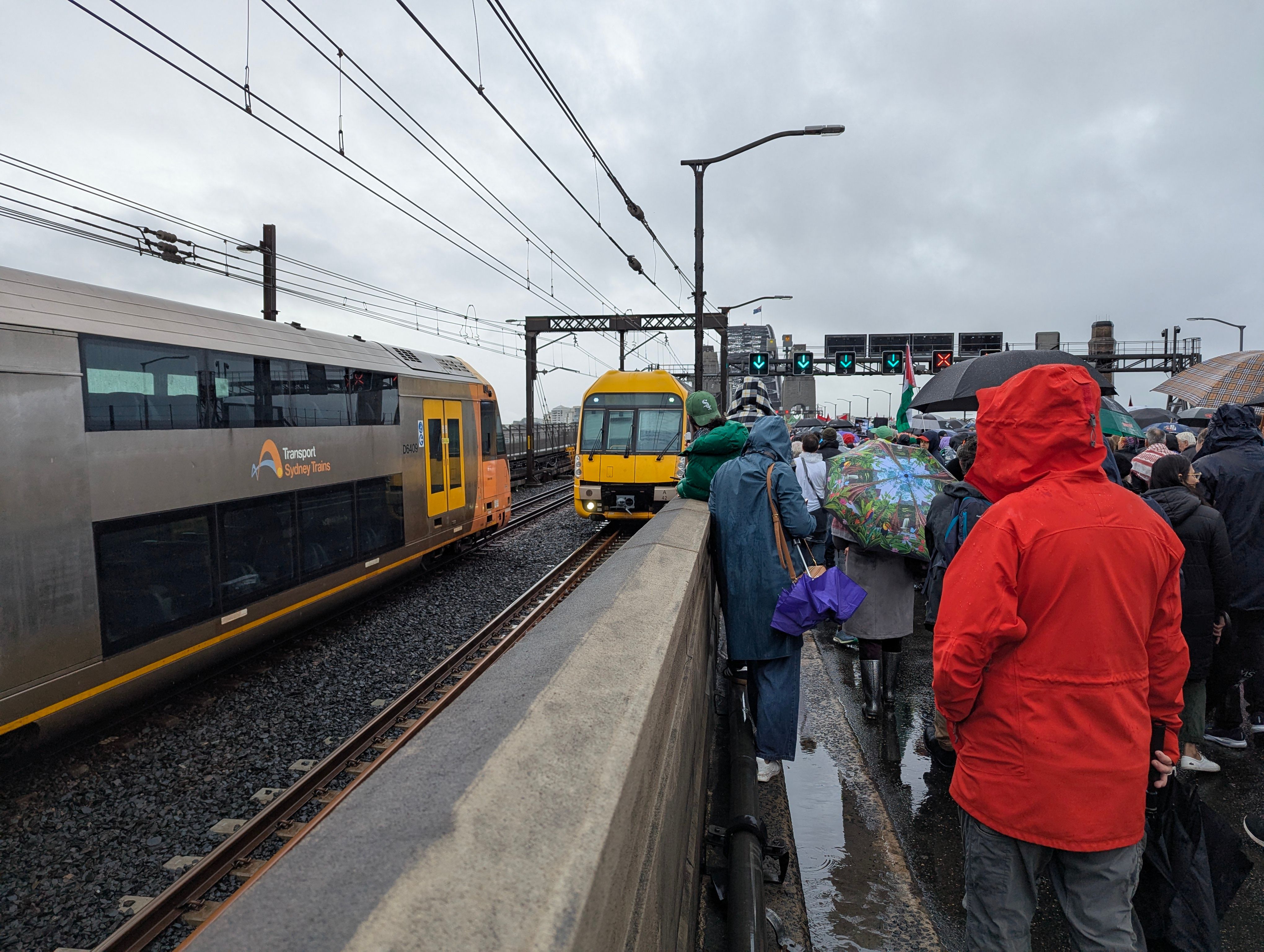 Two Waratah Series 1 trains, A42 and an unknown set passing each other on the Harbour Bridge taken from the car lanes during the pro-Palestine march