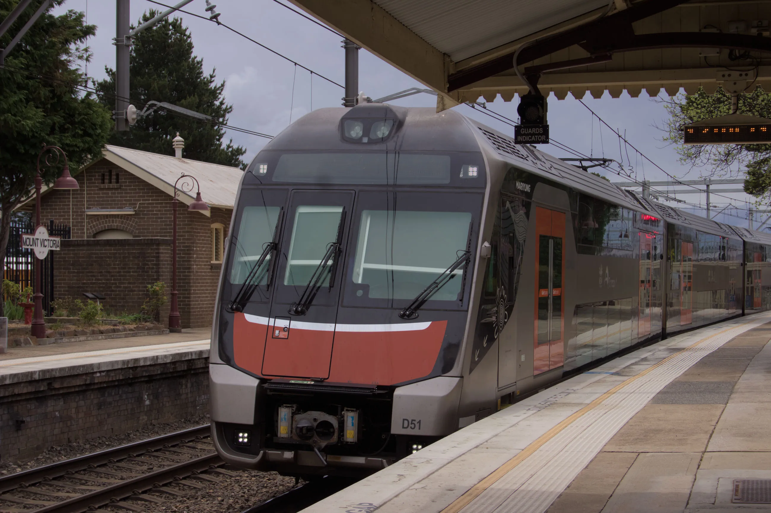 A 10-car D set lead by D51 slowly proceeds through the platform at Mt. Victoria as a test train on the BMT, to be introduced into passenger service shortly.